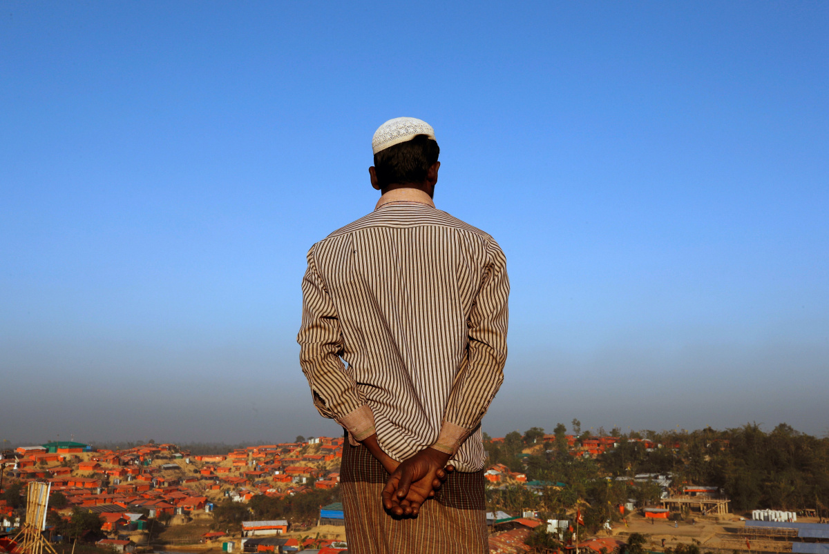 A Rohingya refugee looks at the view from a hill at Palong Khali refugee camp near Cox's Bazar