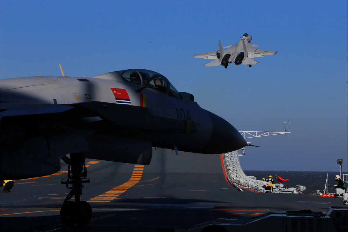 A live-fire drill using an aircraft carrier is seen carried out in the Bohai sea, China, December 14, 2016. Picture taken December 14, 2016. REUTERS/Stringer