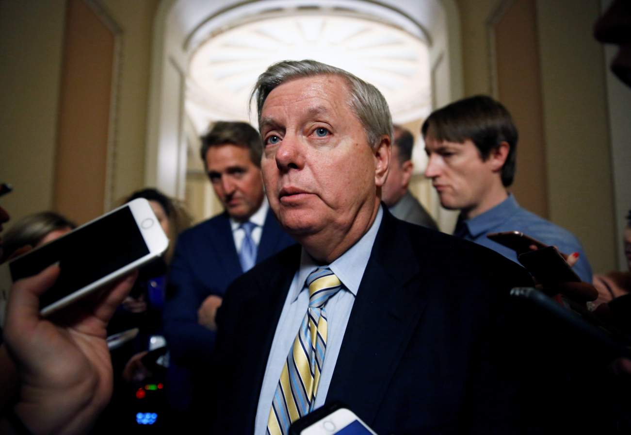 Senator Lindsey Graham (R-SC) speaks to reporters as he attempts to end a shut down of the federal government in Washington