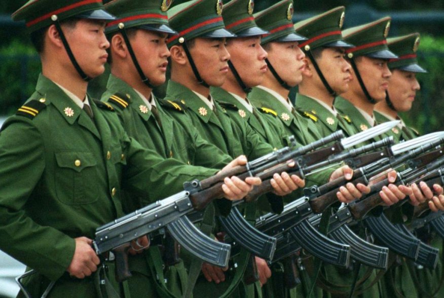 Chinese soldiers perform drills with semi-automatic rifles June 3 in front of Beijing's Great Hall of the People in Tiananmen Square on the eve of the ninth anniversary of the 1989 Tiananmen Square massacre.