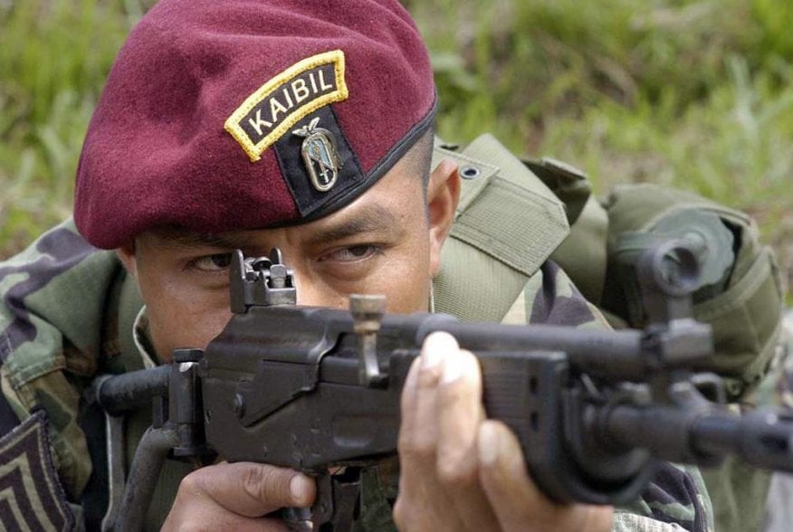 A Kaibil shows the proper way to fire a Galil assault rifle during an exhibition in the Special Forces Brigade, known as "Kaibil's Hell", in Poptun, Peten, October 30, 2006. REUTERS/Carlos Duarte