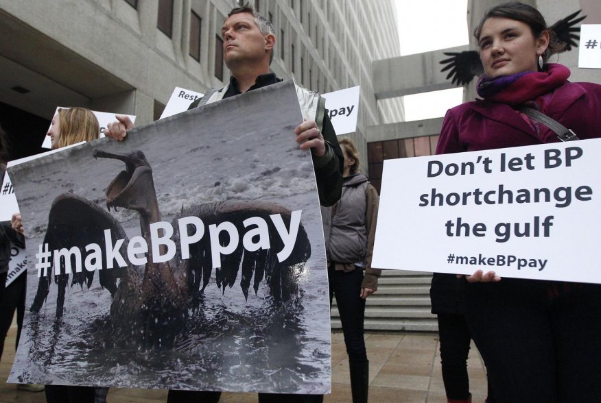 Activists protest in front of the Hale Boggs Federal Building on the first day of the trial over the Deepwater Horizon oil rig spill in New Orleans, Louisiana February 25, 2013. REUTERS/Jonathan Bachman