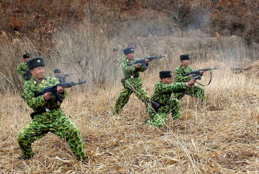 North Korean soldiers with weapons attend military training in an undisclosed location in this picture released by the North's official KCNA news agency in Pyongyang March 11, 2013. 