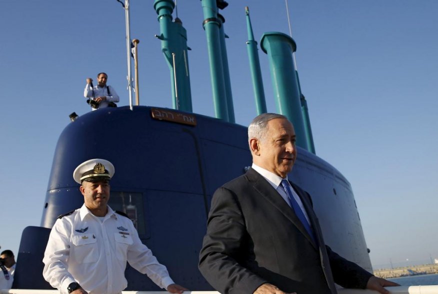 Israeli Prime Minister Benjamin Netanyahu (R) walks on the Rahav, the fifth submarine in the fleet, after it arrived in Haifa port January 12, 2016. REUTERS/Baz Ratner