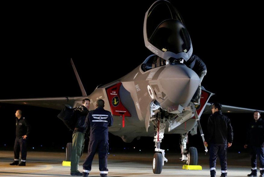 Israeli soldiers walk near a F-35 fighter jet after it landed in Israel at Nevatim air base after the Israeli air force bought them at Nevatim in southern Israel December 12, 2016. REUTERS/Amir Cohen