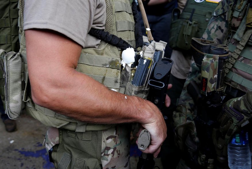 A militia member has an egg on his body armor during rally in Charlottesville, Virginia, U.S., August 12, 2017. REUTERS/Joshua Roberts