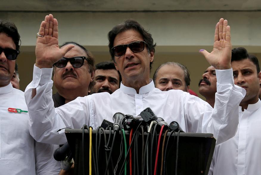 Cricket star-turned-politician Imran Khan, chairman of Pakistan Tehreek-e-Insaf (PTI), speaks after voting in the general election in Islamabad, Pakistan July 25, 2018. REUTERS/Athit Perawongmetha/File Photo