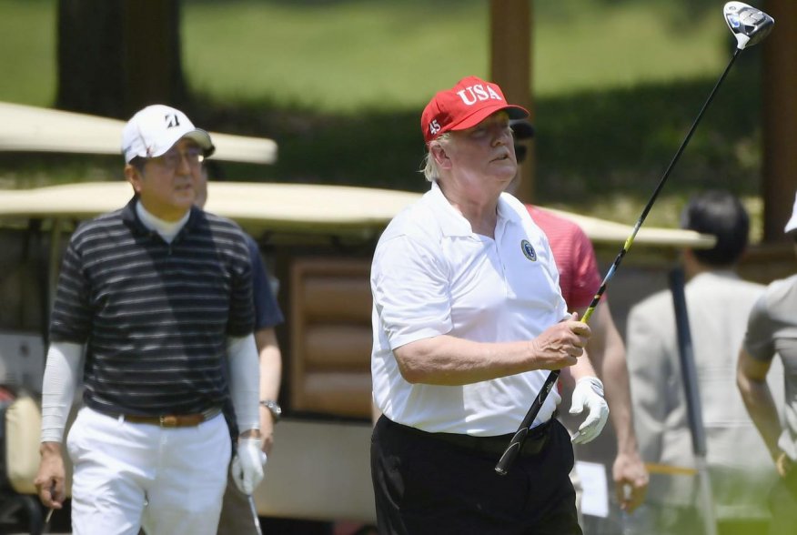 U.S. President Donald Trump and Japan's Prime Minister Shinzo Abe play golf at Mobara Country Club in Mobara, Chiba prefecture, Japan May 26, 2019, in this photo taken by Kyodo. Mandatory credit Kyodo/via REUTERS 