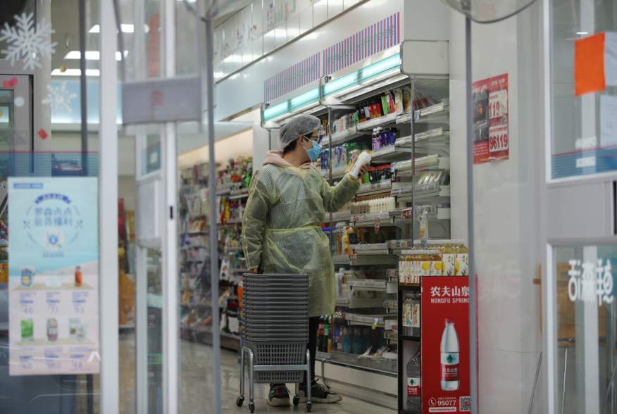 A worker is seen inside a convenience store following an outbreak of the novel coronavirus in Wuhan, Hubei province, China February 11, 2020. REUTERS/Stringer