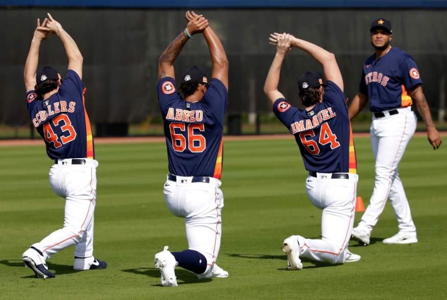 West Palm Beach, Florida, USA; Houston Astros pitcher Lance McCullers Jr (43) and pitcher Bryan Abreu (66) and pitcher Kent Emanuel (64) and pitcher Josh James (right) stretch during a spring training workout at FITTEAM Ballpark. Feb 14, 2020; Rhona Wise-
