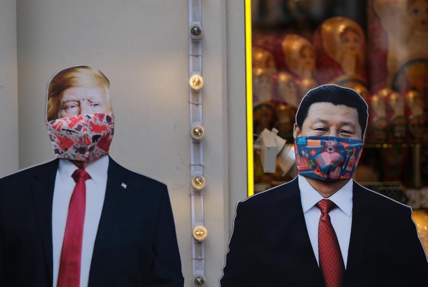 A view shows cardboard cutouts, displaying images of U.S. President Donald Trump and Chinese President Xi Jinping, with protective masks widely used as a preventive measure against coronavirus disease (COVID-19), near a gift shop in Moscow, Russia March 2
