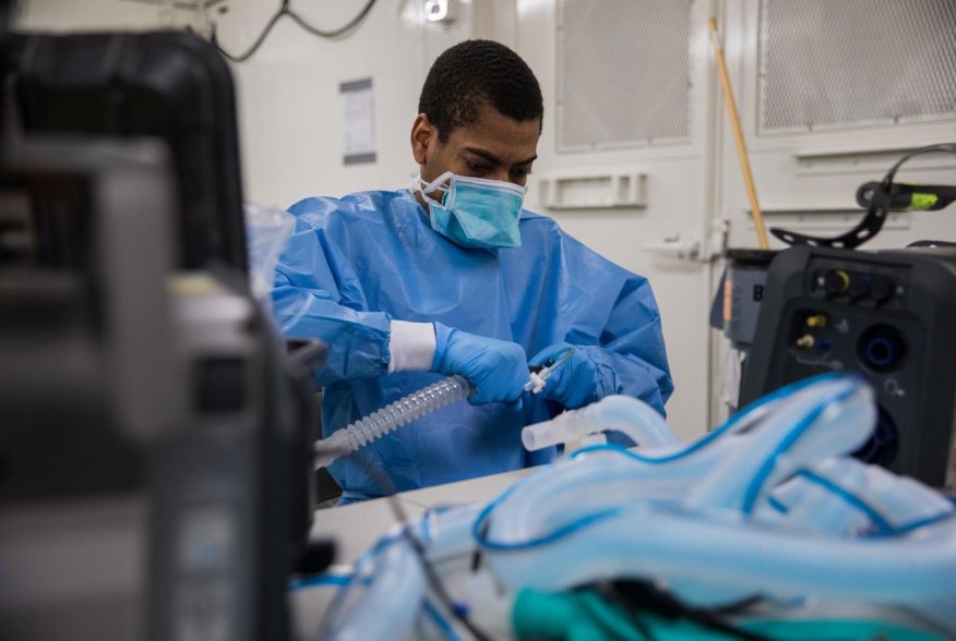 U.S. Army Specialist Fredrick Spencer assembles a T1 Hamilton ventilator in a mobile lab unit in the Javits New York Medical Station intensive care unit bay monitoring coronavirus disease (COVID-19) patients in New York City, U.S. April 4, 2020. U.S. Navy