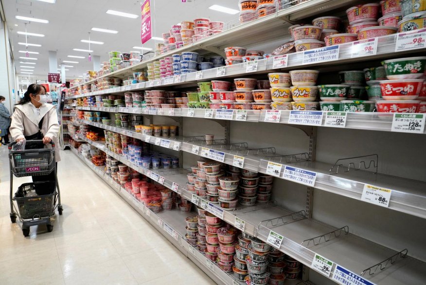 A shopper, wearing a protective mask, looks at shelves at a supermarket, following the outbreak of coronavirus disease (COVID-19), in Tokyo, Japan April 7, 2020. REUTERS/Naoki Ogura