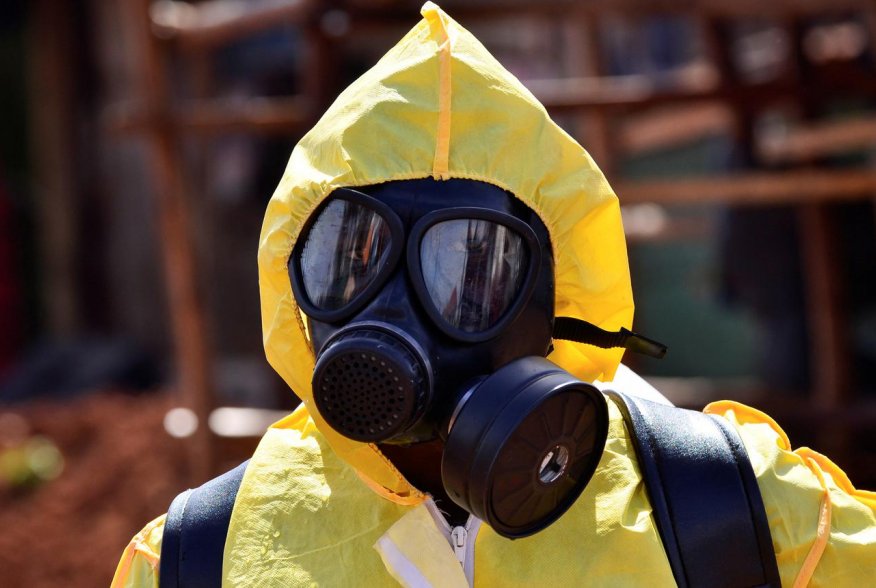 A Ugandan health official wearing protective gear prepares to disinfect the Nakawa open-air market as part of the measures to prevent the spread of the coronavirus disease (COVID-19), within in Nakawa division of Kampala, Uganda April 17, 2020. REUTERS/Ab