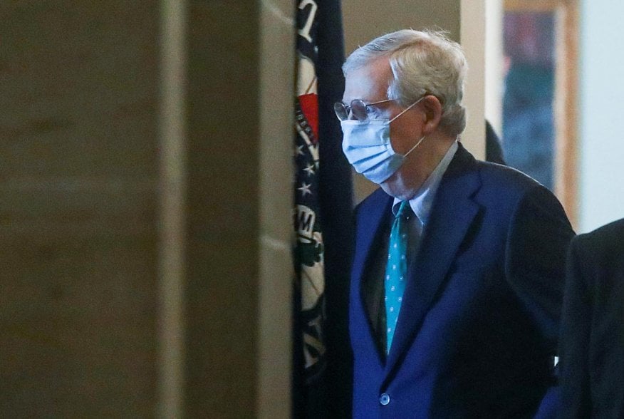 U.S. Senate Majority Leader Mitch McConnell (R-KY) wears a protective mask as he arrives at his office inside the U.S. Capitol after senators returned to Capitol Hill amid concerns that their legislative sessions could put lawmakers and staff at risk of c