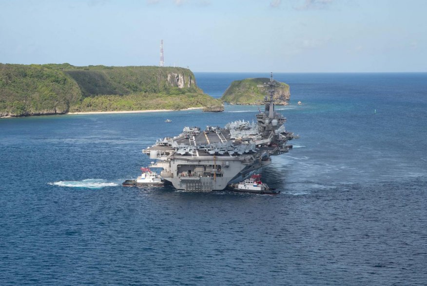The U.S. Navy aircraft carrier USS Theodore Roosevelt departs following an extended visit in the midst of a coronavirus disease (COVID-19) outbreak, from Apra Harbor, Guam May 21, 2020. Picture taken May 21, 2020. U.S. Navy/Mass Communication Specialist S