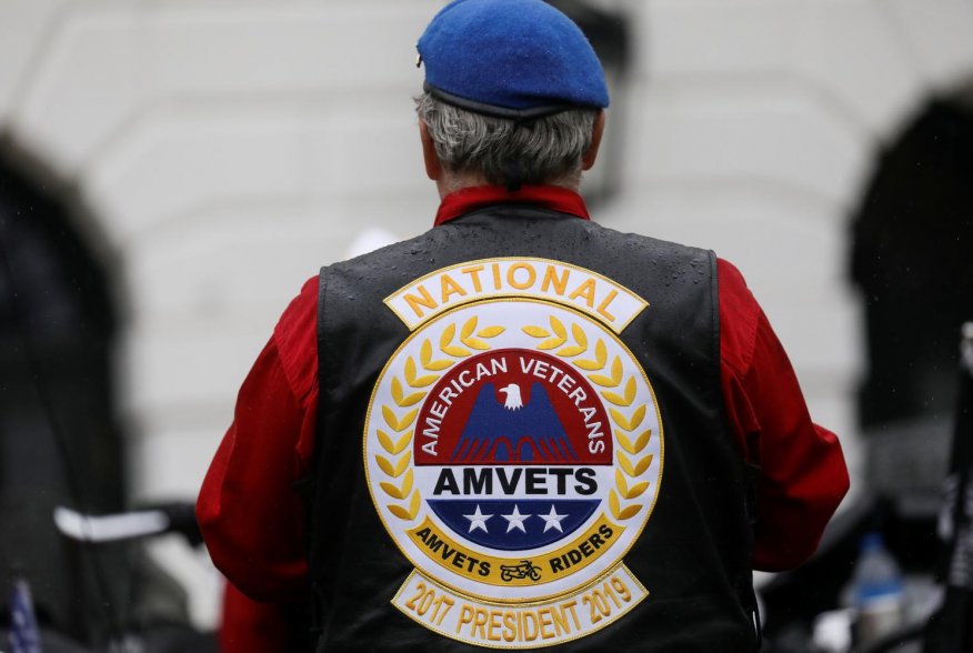 A veteran sits atop his motorcycle as U.S. President Donald Trump hosts a ceremony honoring veterans ahead of the Memorial Day holiday at the White House in Washington, U.S., May 22, 2020. REUTERS/Leah Millis