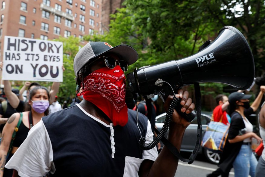 A demonstrator talks through a megaphone during a protest against the death in Minneapolis police custody of George Floyd, in the Manhattan borough of New York City, New York, U.S., June 5, 2020. REUTERS/Mike Segar