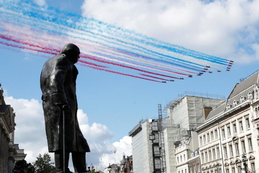 The Red Arrows and La Patrouille de France perform a flypast over a statue of Winston Churchill, during a meeting of British Prime Minister Boris Johnson and French President Emmanuel Macron in London, Britain, June 18, 2020. REUTERS/Peter Nicholls