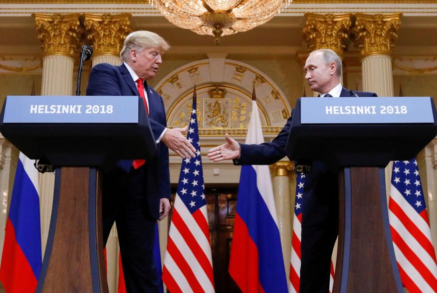 U.S. President Donald Trump and Russia's President Vladimir Putin shake hands during a joint news conference after their meeting in Helsinki, Finland, July 16, 2018. REUTERS/Kevin Lamarque