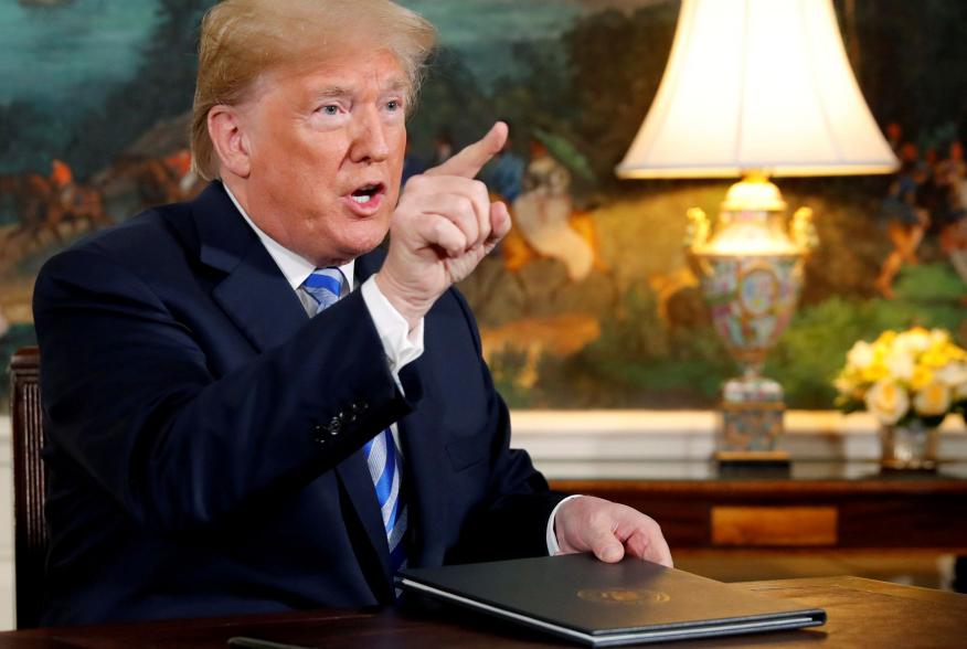 FILE PHOTO: U.S. President Donald Trump speaks to reporters after signing a proclamation declaring his intention to withdraw from the JCPOA Iran nuclear agreement in the Diplomatic Room at the White House in Washington, U.S. May 8, 2018. REUTERS/Jonathan 