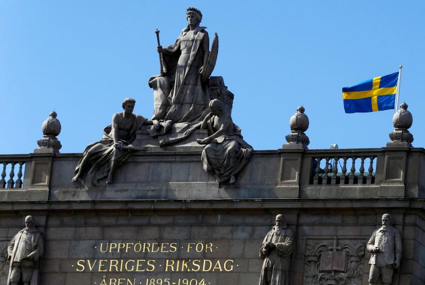 The Swedish flag flutters next to the Riksdag, the Swedish Parliament, in Stockholm, Sweden, May 7, 2017. REUTERS/Ints Kalnins