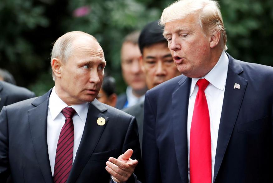 U.S. President Donald Trump and Russia's President Vladimir Putin talk during the family photo session at the APEC Summit in Danang, Vietnam November 11, 2017. REUTERS/Jorge Silva TPX IMAGES OF THE DAY