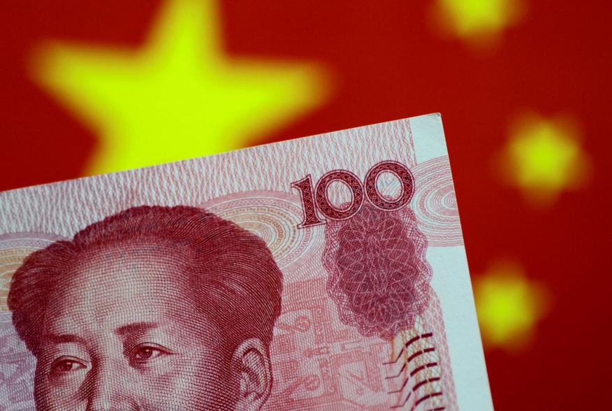 FILE PHOTO: A China yuan note is seen in this illustration photo May 31, 2017. REUTERS/Thomas White/Illustration/File Photo