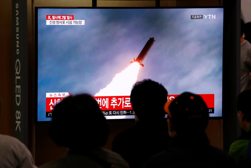 People watch a TV broadcast showing a file footage for a news report on North Korea firing two projectiles, possibly missiles, into the sea between the Korean peninsula and Japan, in Seoul, South Korea, October 31, 2019. REUTERS/Heo Ran