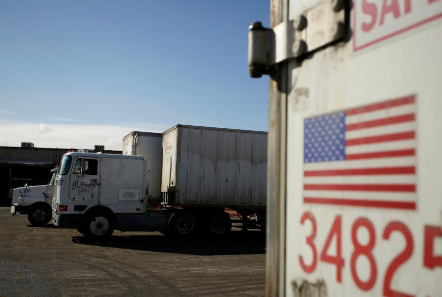 A U.S. flag is pictured on a truck loaded with merchandise at the freight shipping company Sotelo, which transports goods between Mexico and the United States, in Ciudad Juarez, Mexico, December 10, 2019. REUTERS/Jose Luis Gonzalez