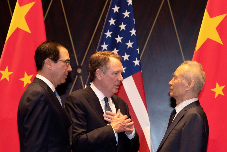 United States Trade Representative Robert Lighthizer gestures as he chats with Chinese Vice Premier Liu He with Treasury Secretary Steven Mnuchin, looking on after posing for a family photo at the Xijiao Conference Center in Shanghai, China, July 31, 2019
