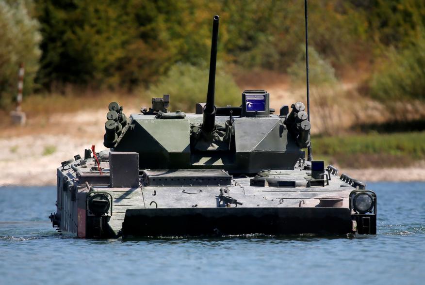 A ZBD-03 armoured infantry fighting vehicle, operated by a crew from China, drives through a water obstacle during the Paratrooper's platoon competition for airborne squads, part of the International Army Games 2016, at the Rayevsky shooting range outside