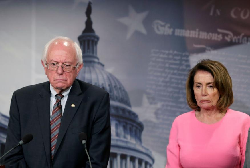 U.S. House Minority Leader Nancy Pelosi (D-CA) and Sen. Bernie Sanders (I-VT) react during a news conference on release of the president's FY2018 budget proposal on Capitol Hill in Washington, U.S., May 23, 2017. REUTERS/Yuri Gripas TPX IMAGES OF THE DAY