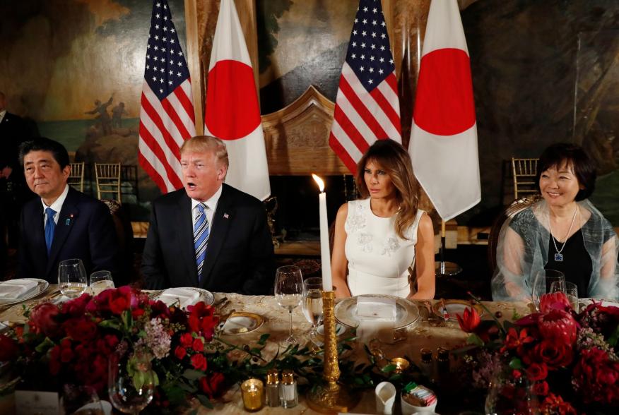 U.S. President Donald Trump (2nd from L) speaks as he sits down to dine with first lady Melania Trump, Japan's Prime Minister Shinzo Abe and his wife Akie (R) at Trump's Mar-a-Lago estate in Palm Beach, Florida, U.S., April 18, 2018. REUTERS/Kevin Lamarqu