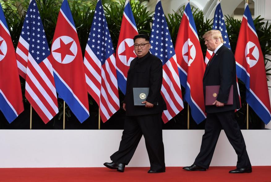 U.S. President Donald Trump and North Korea's leader Kim Jong Un walk during their summit at the Capella Hotel on Sentosa island in Singapore June 12, 2018. Anthony Wallace/Pool via Reuters TPX IMAGES OF THE DAY