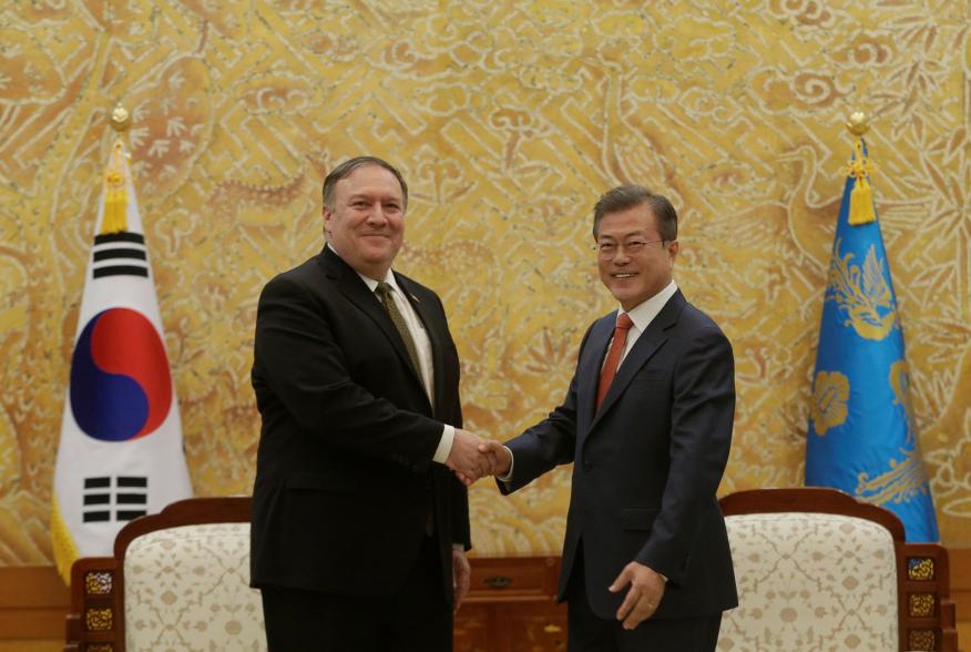 South Korean President Moon Jae-in, right, shakes hands with U.S. Secretary of State Mike Pompeo during a meeting at the presidential Blue House in Seoul, South Korea Ocober 7, 2018. Ahn Young-joon/Pool via REUTERS