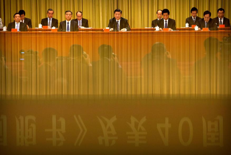 A banner is reflected on a polished surface as Chinese President Xi Jinping (C) speaks during an event to commemorate the 40th anniversary of the "Message to Compatriots in Taiwan" at the Great Hall of the People in Beijing, China January 2, 2019. REUTERS