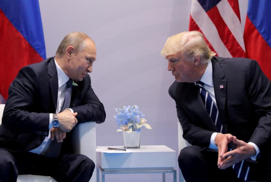 Russia's President Vladimir Putin talks to U.S. President Donald Trump during their bilateral meeting at the G20 summit in Hamburg, Germany, July 7, 2017. REUTERS/Carlos Barria//File Photo