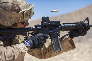Jordan - A 26th Marine Expeditionary Unit (MEU) Maritime Raid Force Marine fires an M4 Carbine at a range in Jordan, June 19, 2013. Exercise Eager Lion 2013 is an annual, multinational exercise designed to strengthen military-to-military relationships and