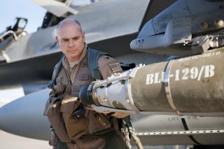 U.S. Air Force Col. Henry Rogers, 421st Expeditionary Fighter Squadron, conducts pre-flight inspections on an F-16 Fighting Falcon aircraft at Bagram Airfield, Afghanistan, Nov. 27, 2015. U.S. Air Force photo by Tech. Sgt. Robert Cloys