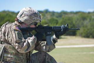 Fort Hood - 1st Lt. Elizabeth Kraft, an Army Reserve Soldier with the 316th Sustainment Command (Expeditionary), based out of Coraopolis, Pa., shoots her M4 carbine at popup targets during qualification at Fort Hood, Tx., Oct. 9, 2016.