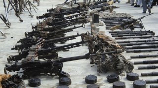 A weapons cache, discovered following a two-day operation by the Afghan National Directorate of Security, is seen on display for the media in Kandahar City March 1, 2011.