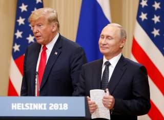U.S. President Donald Trump and Russian President Vladimir Putin arrive for a joint news conference after their meeting in Helsinki, July 16, 2018. REUTERS/Grigory Dukor