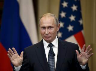 Russia's President Vladimir Putin gestures during the joint press conference with U.S. President Donald Trump in the Presidential Palace in Helsinki, Finland July 16, 2018. Lehtikuva/Jussi Nukari