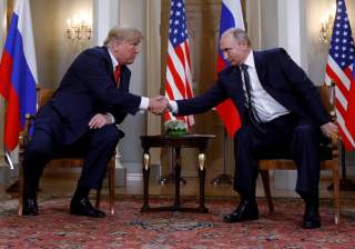 U.S. President Donald Trump and Russia's President Vladimir Putin shake hands as they meet in Helsinki, Finland July 16, 2018. REUTERS/Kevin Lamarque 