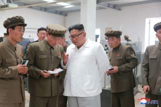 North Korean leader Kim Jong Un gives field guidance during his visit to a machine factory under the Ranam Coal Mining Machine Complex in this undated photo released by North Korea's Korean Central News Agency (KCNA) in Pyongyang July 17, 2018. KCNA via R