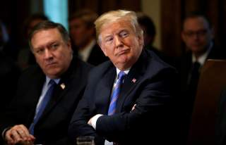 U.S. Secretary of State Mike Pompeo and President Donald Trump listen during a cabinet meeting at the White House in Washington, U.S., July 18, 2018. REUTERS/Leah Millis