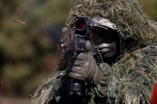 A South Korean marine in action during their regular drill on Yeonpyeong Island, South Korea November 1, 2018. Jeon Heon-Kyun/Pool via REUTERS TPX IMAGES OF THE DAY