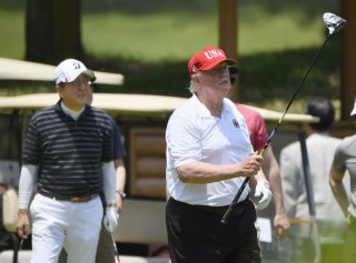 U.S. President Donald Trump and Japan's Prime Minister Shinzo Abe play golf at Mobara Country Club in Mobara, Chiba prefecture, Japan May 26, 2019, in this photo taken by Kyodo. Mandatory credit Kyodo/via REUTERS 