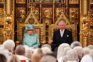 Britain's Queen Elizabeth sits on the Sovereign's Throne next to Prince Charles before reading the Queen's Speech during the State Opening of Parliament at the Houses of Parliament in London, Britain December 19, 2019. REUTERS/Hannah McKay/Pool